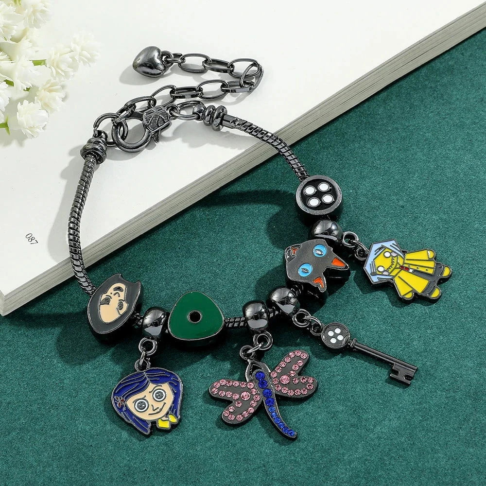Coraline and the Secret Door Charm Bracelets - The Pink Controller 