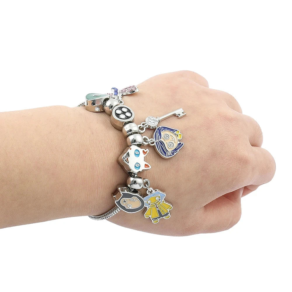 Coraline and the Secret Door Charm Bracelets - The Pink Controller 