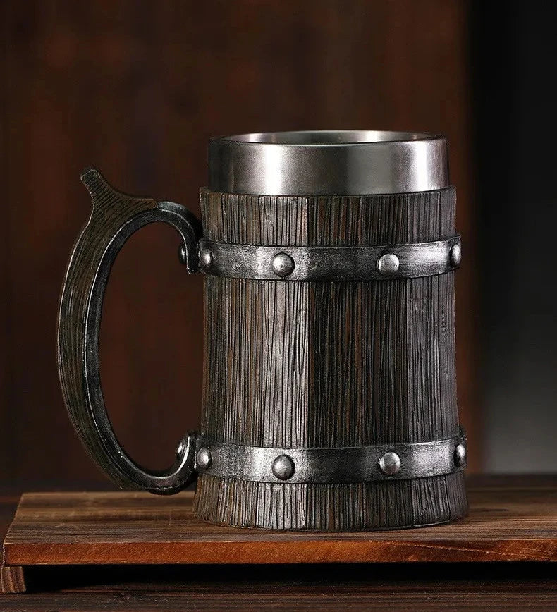 Wooden mug with metal accents on a wooden surface