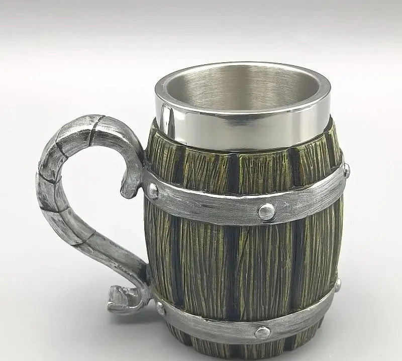 Wooden mug with metal handle and rim on a white background